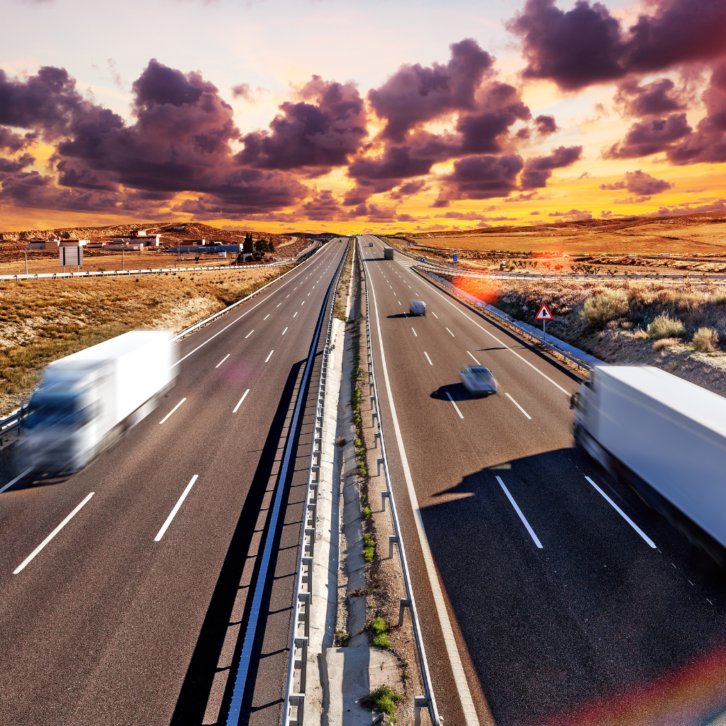 Trucks driving on highway.